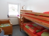 Schlafzimmer mit Etagen- und Kinderbett